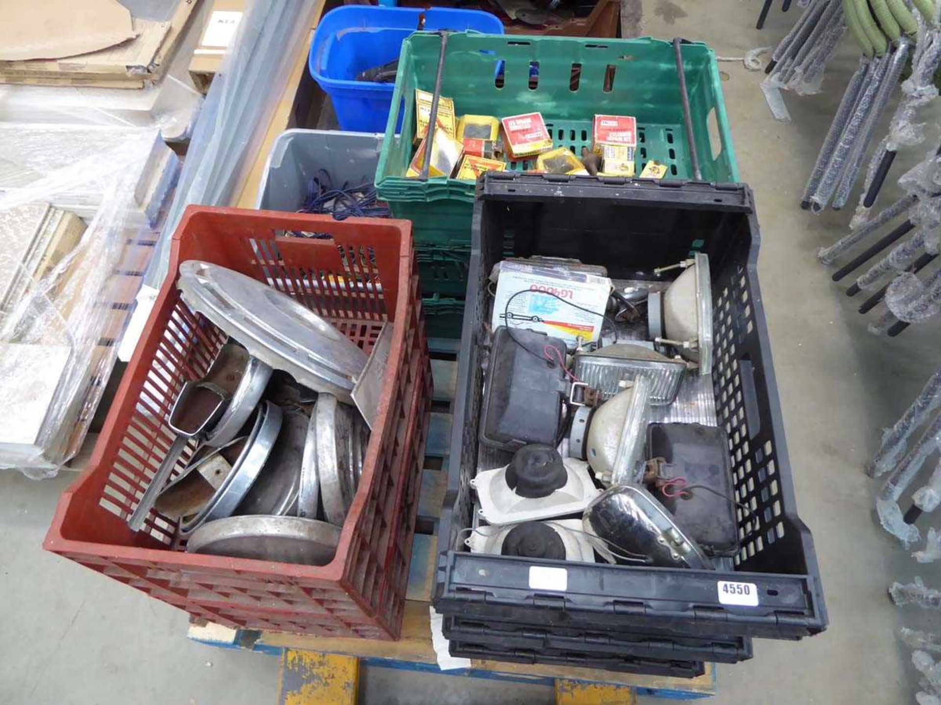 Pallet of vintage car parts and accessories including wiring looms, mirrors, lamps, brake shoes