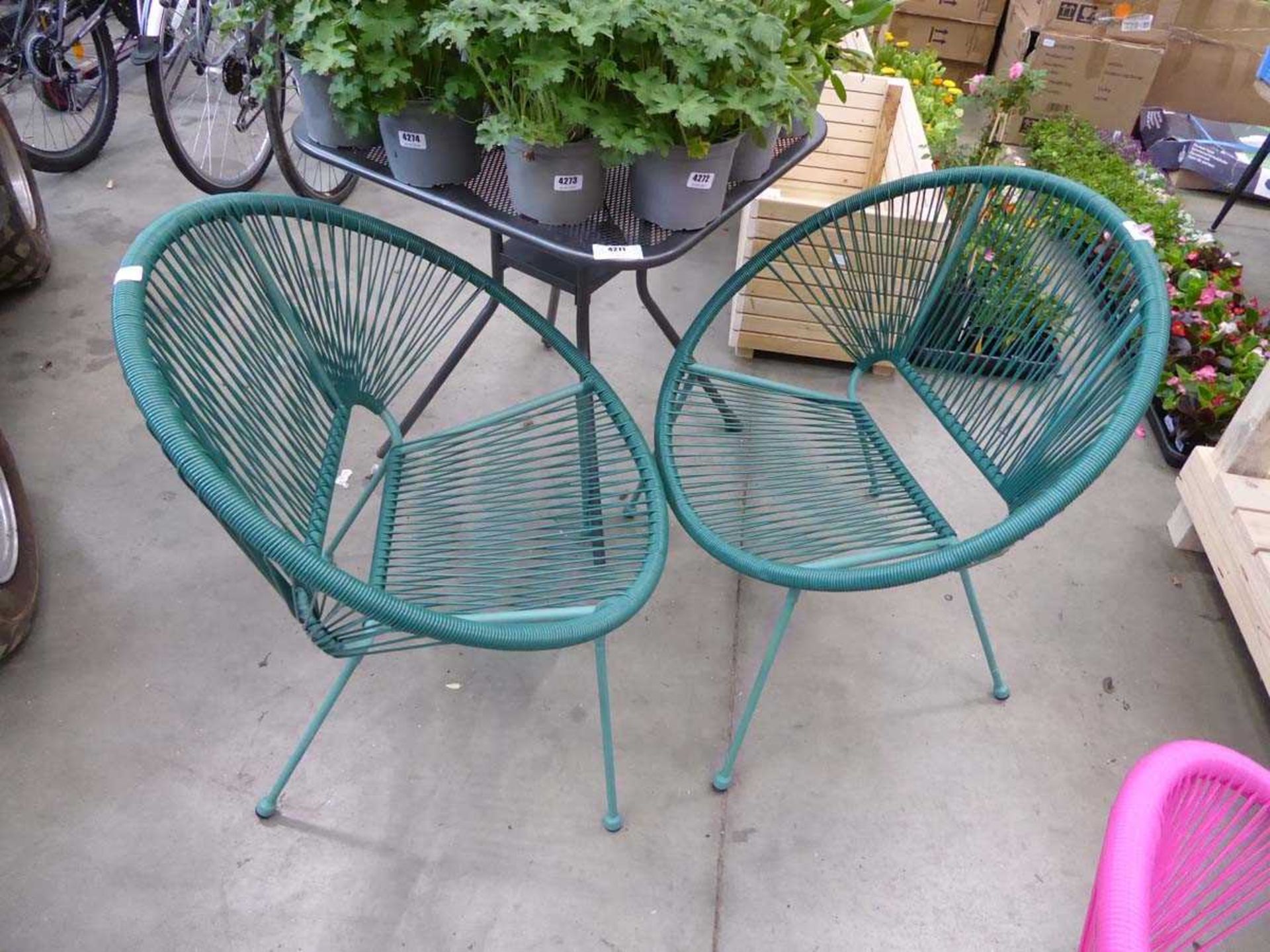 2 green string garden chairs