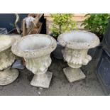 Pair of ornate concrete planters