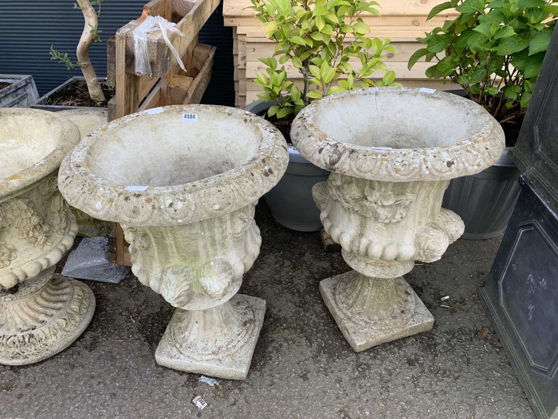 Pair of ornate concrete planters