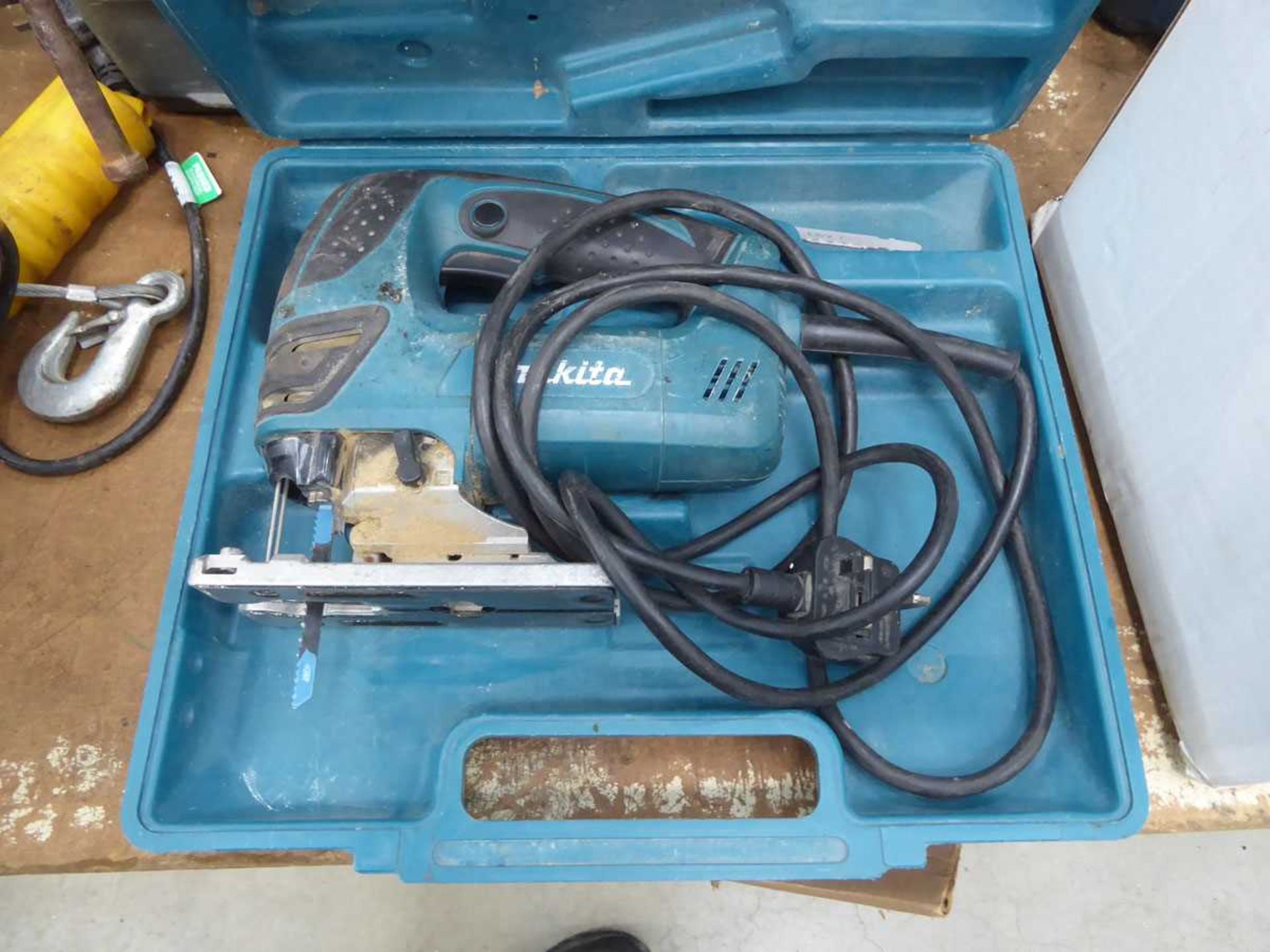 Makita electric jigsaw, plus a box of drill bits