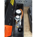 Small box containing pressure gauge