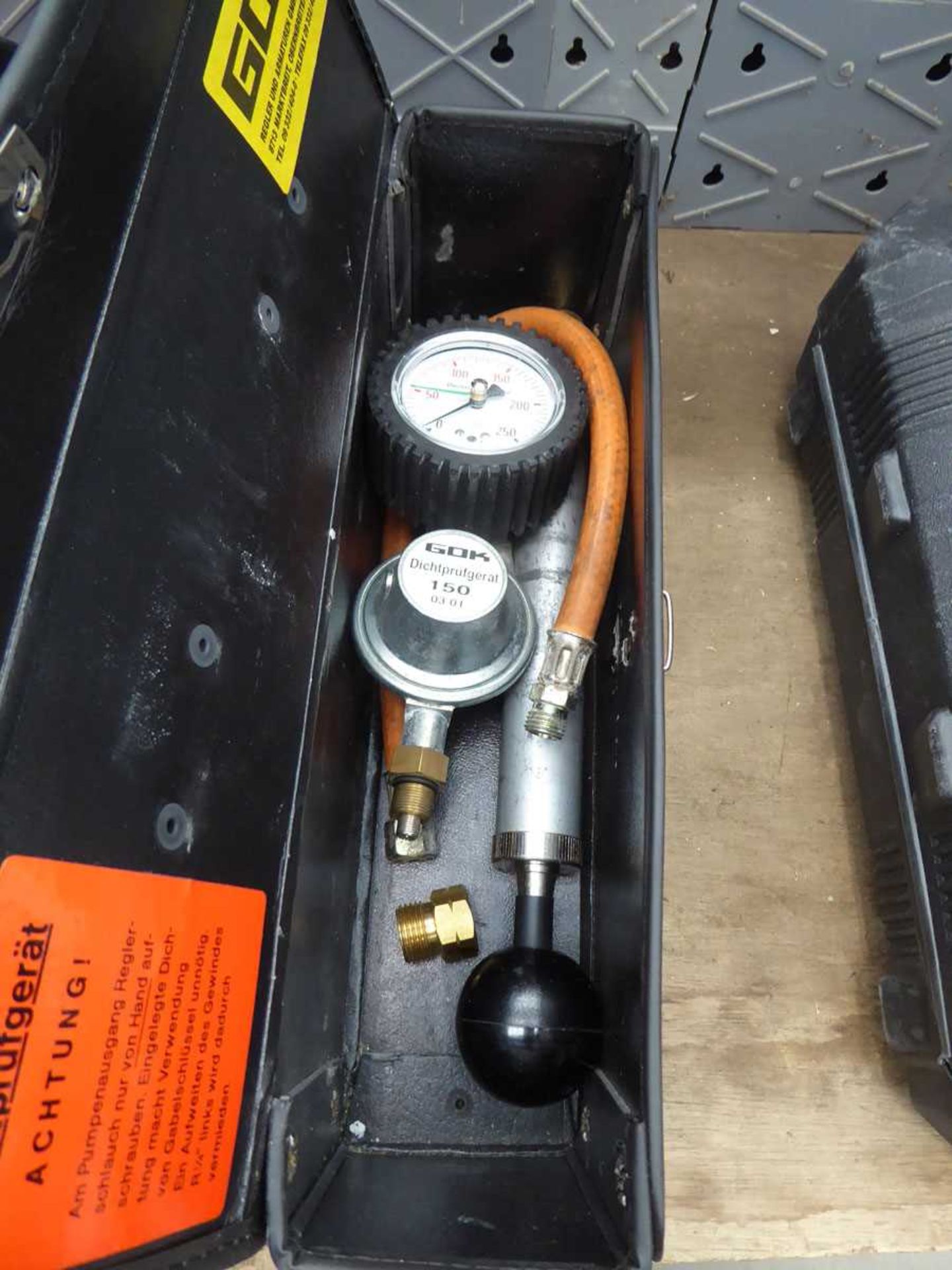 Small box containing pressure gauge