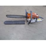 Orange and beige petrol powered chainsaw