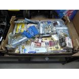 Box containing fixings, door handles, hinges, etc