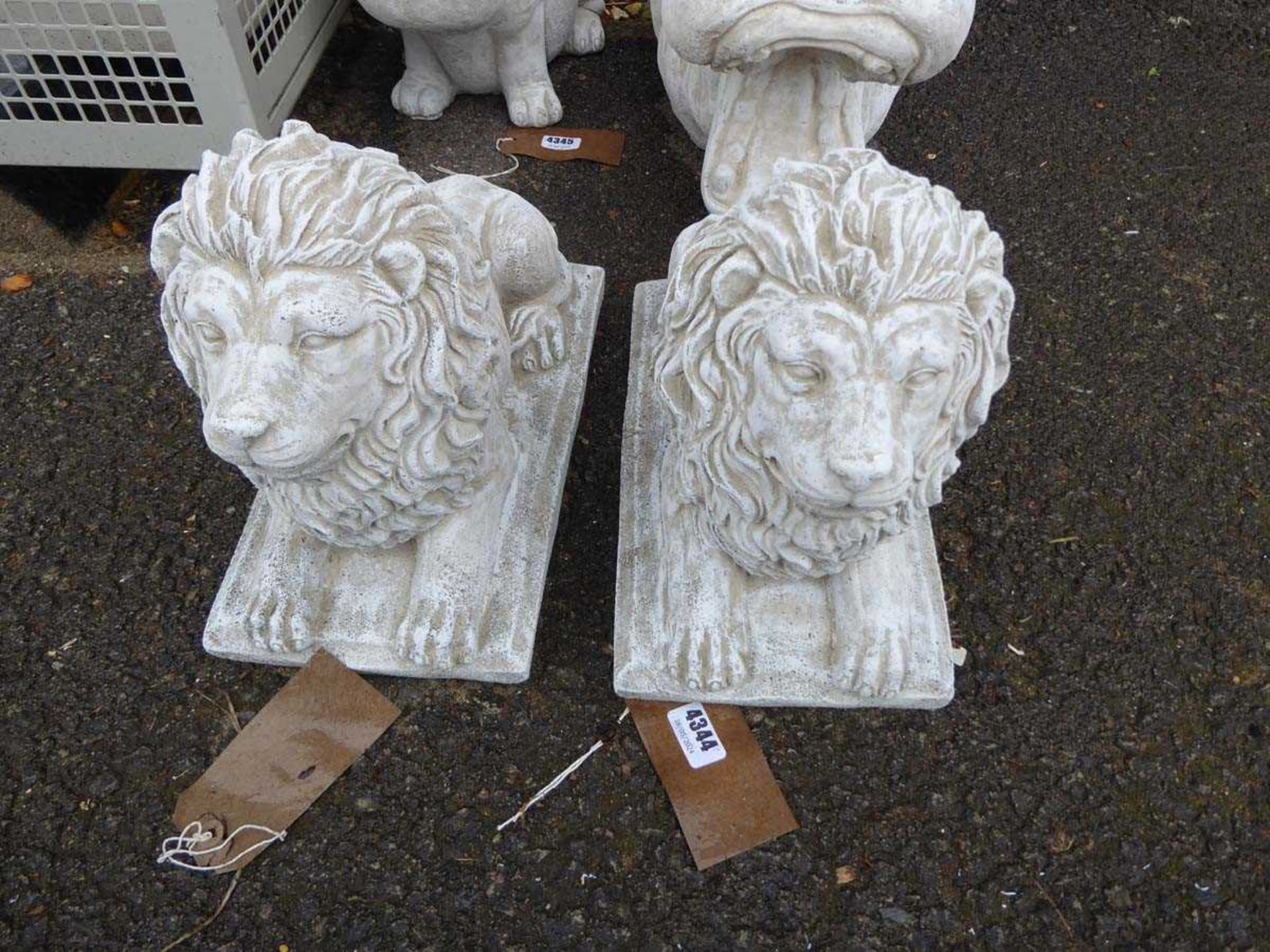 2 concrete lions