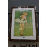 Framed and glazed picture of a female golfer