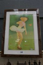 Framed and glazed picture of a female golfer