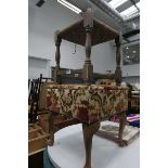 Wicker topped stool and an embroidered lidded stool with floral upholstery
