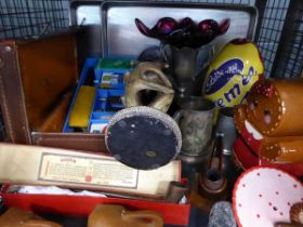 Cage of assorted items to include elephant head figures, antler figures, Cadbury Creme Egg