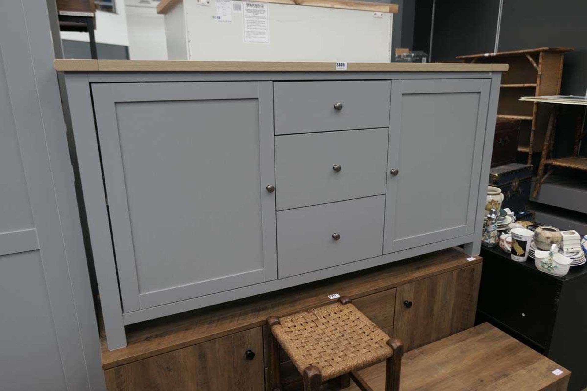 Grey finished sideboard with 2 doors by 3 drawers and light oak top