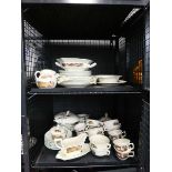 Two cage containing a quantity of Adam's china to include gravy boats, teacups, terrines etc