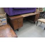 Dark wood desk with 3 drawer pedestals under and leather insert