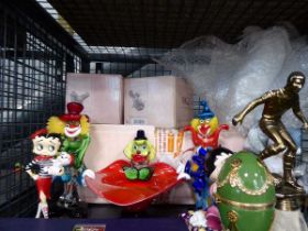 Cage containing glass clown figurenes, footballing trophies, Betty Boop figures