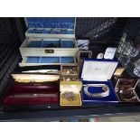 Cage containing various costume jewellery such as watches, bracelets, necklaces, etc