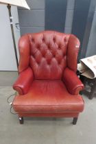 Red leather wing back armchair