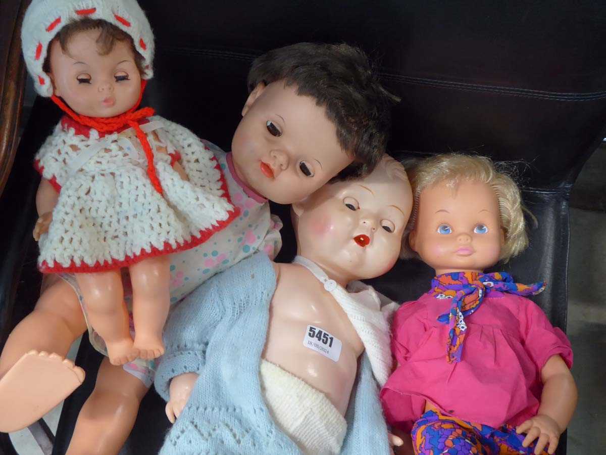 4 assorted dolls