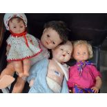 4 assorted dolls