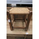Wicker topped stool with oak frame