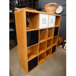 Oak effect pigeon hole storage shelving unit with white and black slide out drawers