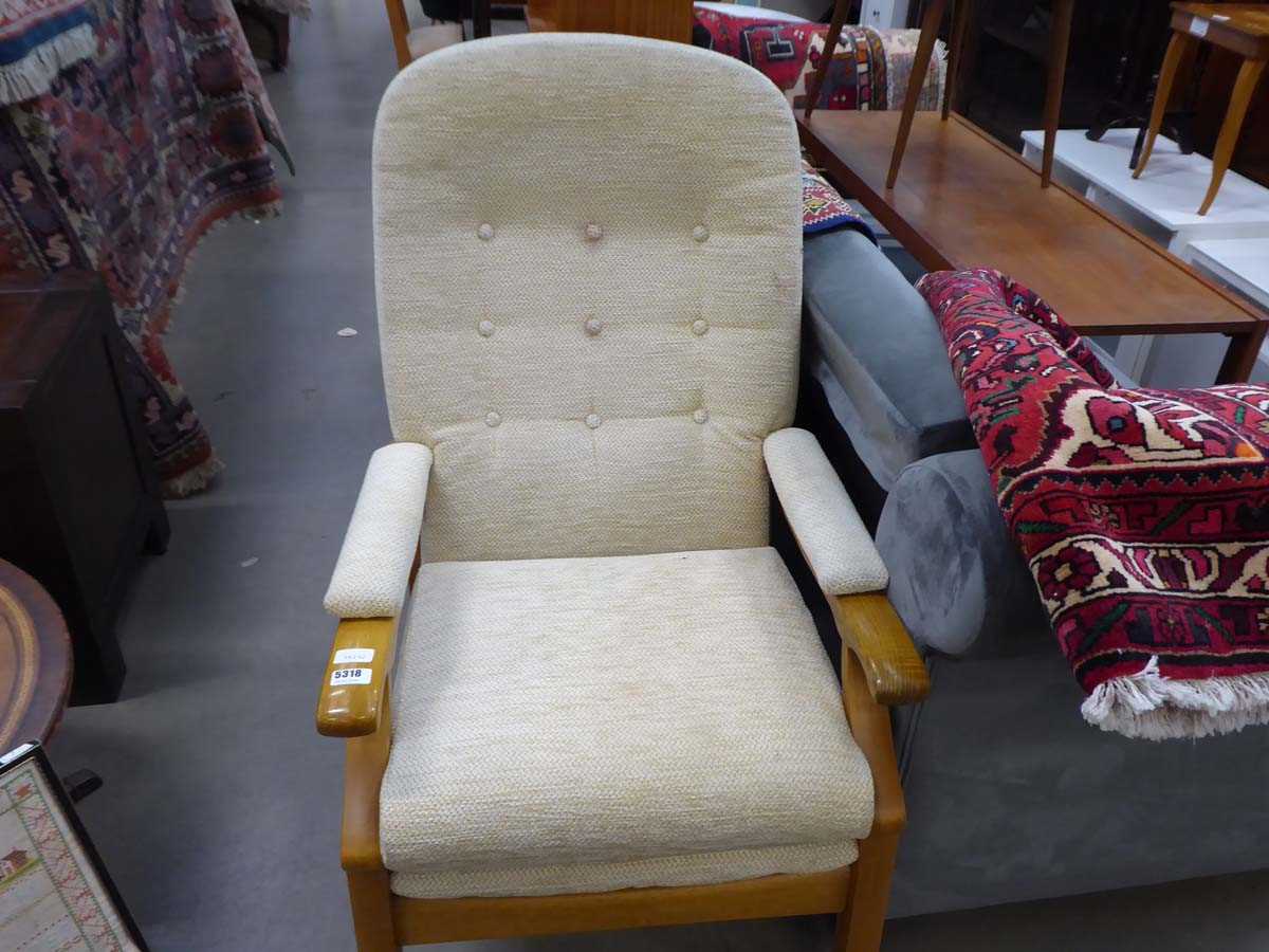 Single armchair with cream upholstery on oak supports