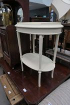 Cream oval occasional table with shelf under