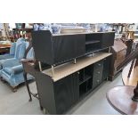 Two black sideboards with light tops