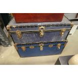 2 x large blue travel trunks