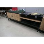 Black low sideboard with 2 wooden doors and shelving unit