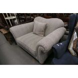 Large single armchair with stripped upholstery