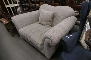 Large single armchair with stripped upholstery