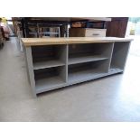 Grey low shelving unit with oak top