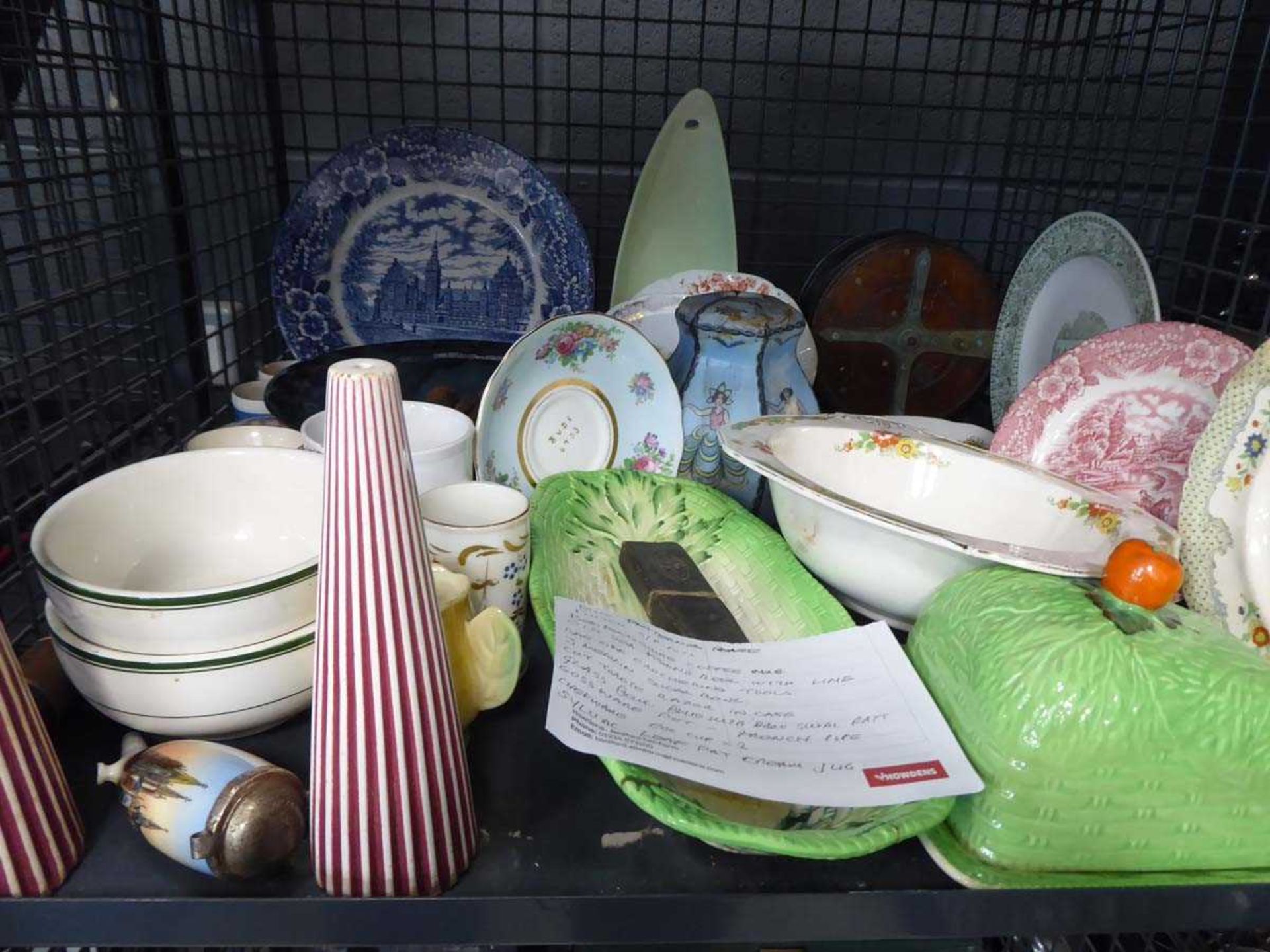 Cage containing Carlton ware, glass lamp shade, fishing reels and mugs