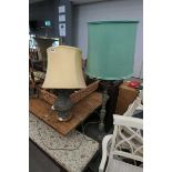 Table lamp and a standard lamp with turned metal bases and oriental design