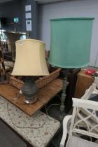 Table lamp and a standard lamp with turned metal bases and oriental design