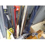 Large quantity of fishing rods and assorted fishing reels