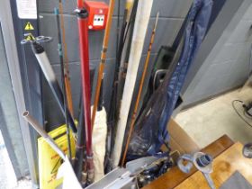 Large quantity of fishing rods and assorted fishing reels