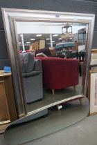 Large silver framed rectangular mirror and an oval mirror