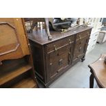 Dark wood sideboard with 2 drawers over 2 doors