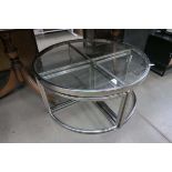 +VAT Glass and chrome topped circular coffee table with single tables under