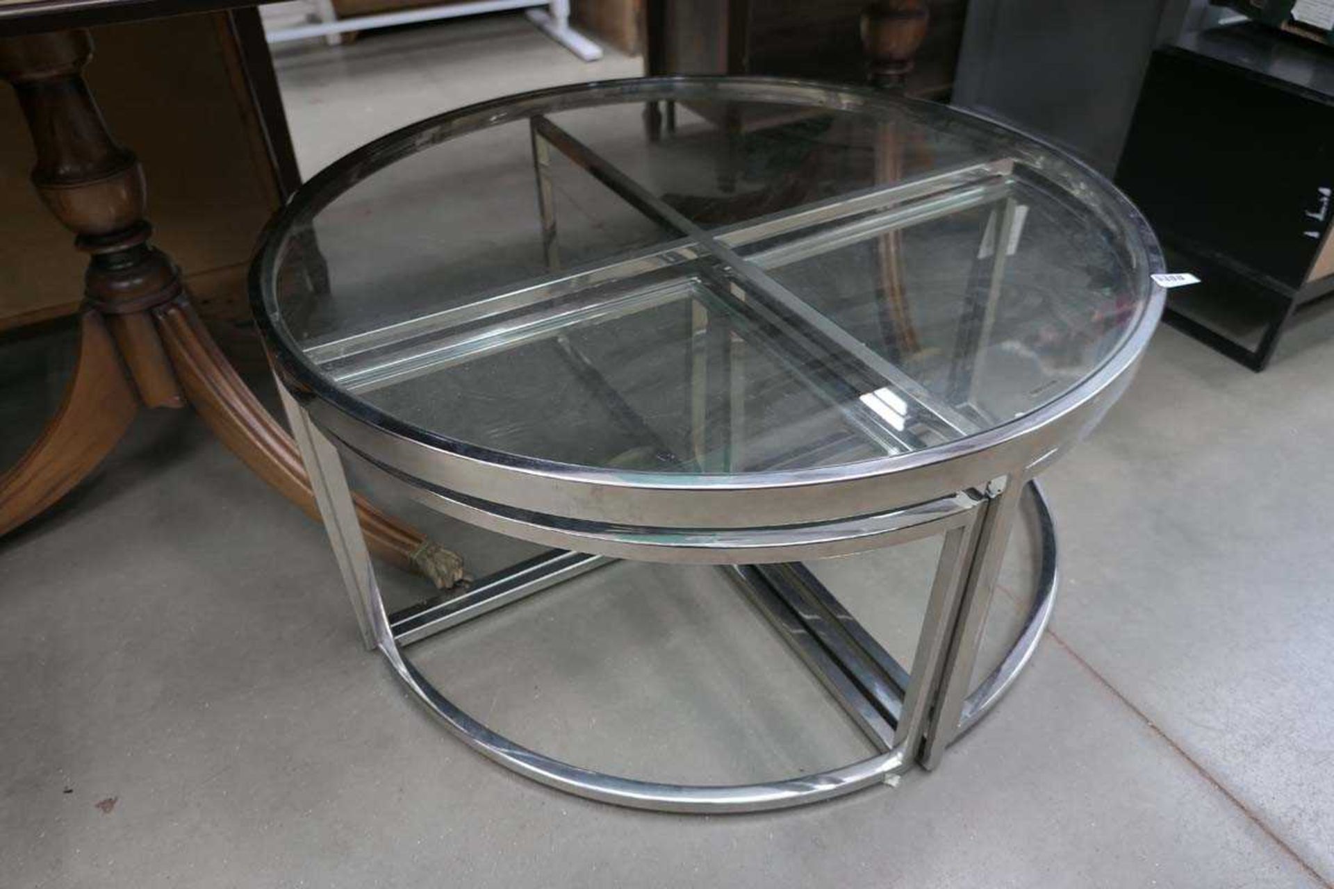 +VAT Glass and chrome topped circular coffee table with single tables under