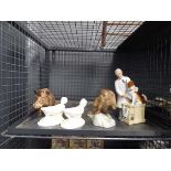 Cage containing a quantity of Royal Doulton and Beswick figurines to include jaguars, wild boars and