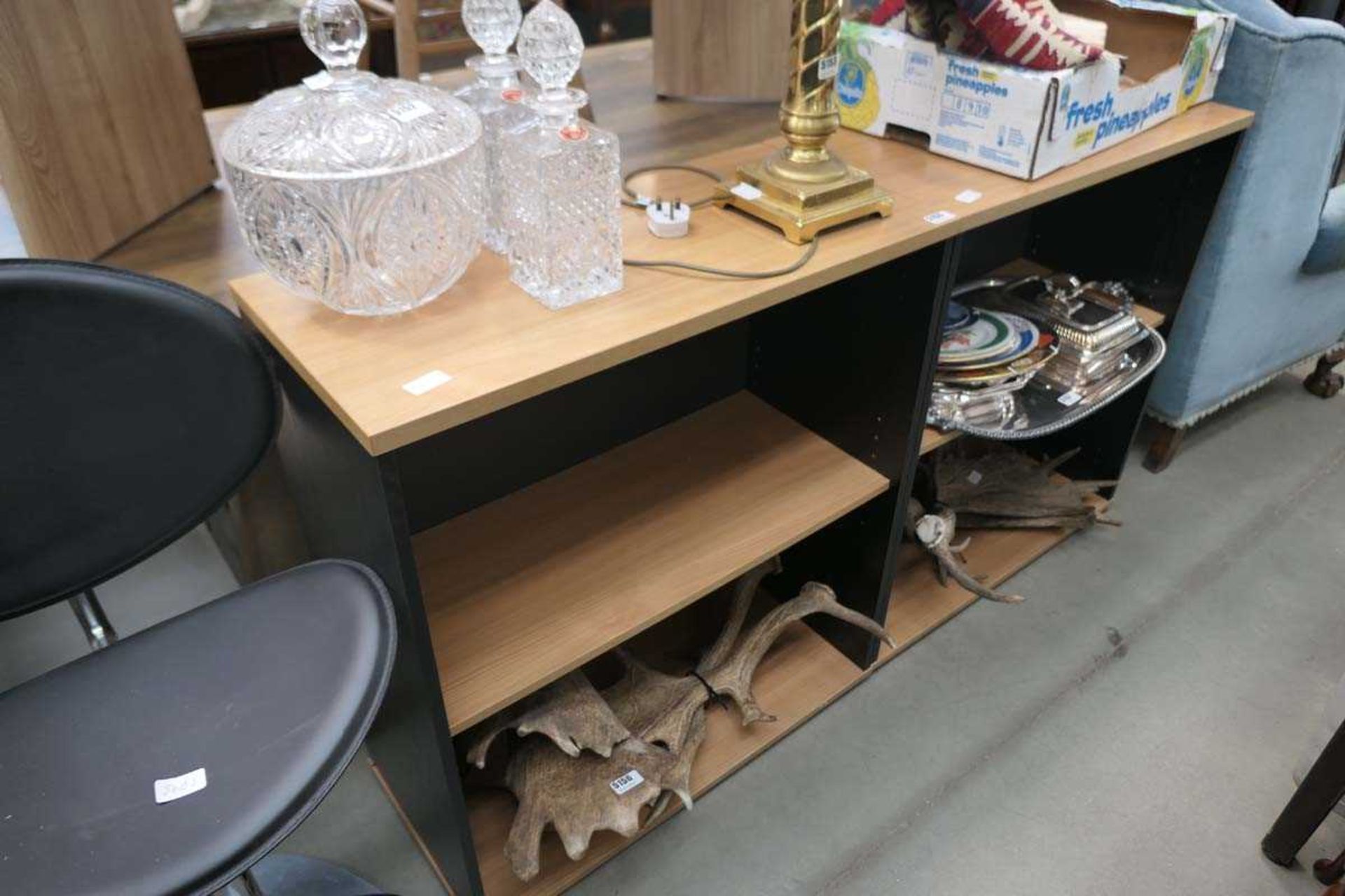 Two light oak shelving units