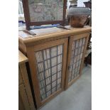 Oak kitchen cupboard with leaded glass doors