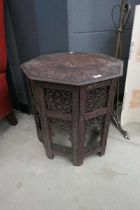 Hexagonal fretwork base table with carved floral top