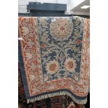 Single Voysey style rug in pale blue and terracotta