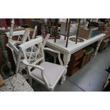 White painted kitchen table with six matching beige upholstered chairs
