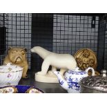 Cage containing apple shaped paper weights, blue and white china, polar bear figurines and bulldog