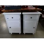 Two white bedside cabinets