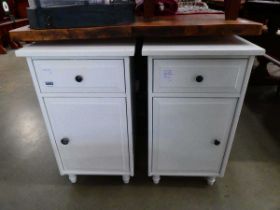 Two white bedside cabinets